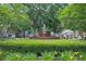 Community fountain surrounded by manicured lawns and mature trees in a neighborhood at 4566 Fountain Ne Dr, Marietta, GA 30067