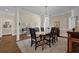Elegant dining room with hardwood floors, stylish chandelier, and view of front entrance at 4566 Fountain Ne Dr, Marietta, GA 30067