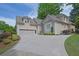 Stately two-story home featuring manicured landscaping and a spacious driveway at 4566 Fountain Ne Dr, Marietta, GA 30067