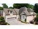 Stately residence boasts a two-car garage and well-manicured landscaping, enhancing its curb appeal at 4566 Fountain Ne Dr, Marietta, GA 30067