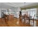 Open-concept kitchen and dining area with wood floors and natural light at 4566 Fountain Ne Dr, Marietta, GA 30067
