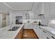 Bright kitchen featuring white cabinets, granite counters, and a stainless steel refrigerator at 4566 Fountain Ne Dr, Marietta, GA 30067