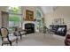 Comfortable living room with fireplace, large windows, and ample seating at 4566 Fountain Ne Dr, Marietta, GA 30067
