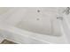 Close-up of the spotless white bathtub with chrome fixtures and a clean, inviting appearance at 7630 Volion Pkwy, Fairburn, GA 30213