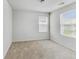 Well-lit, carpeted bedroom featuring natural light and a modern design at 7630 Volion Pkwy, Fairburn, GA 30213