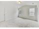 Bright, neutral bedroom with carpet floor, featuring natural light and high ceilings at 7630 Volion Pkwy, Fairburn, GA 30213
