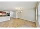 Spacious living room with wood floors, chandelier, and neutral paint at 7630 Volion Pkwy, Fairburn, GA 30213