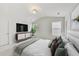Serene main bedroom featuring a plush bed, soft lighting, and a calming color scheme for relaxation at 7630 Volion Pkwy, Fairburn, GA 30213