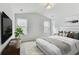 Serene main bedroom featuring a plush bed, soft lighting, and a calming color scheme for relaxation at 7630 Volion Pkwy, Fairburn, GA 30213