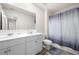 Clean bathroom featuring a double sink vanity and a shower-tub combo at 853 Bentley Drive Dr, Fairburn, GA 30213