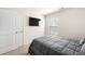 Cozy bedroom featuring a window, a TV, neutral walls, and a plush grey comforter at 853 Bentley Drive Dr, Fairburn, GA 30213