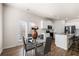 Charming dining area with a glass table that opens to the kitchen space at 853 Bentley Drive Dr, Fairburn, GA 30213