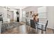 Bright dining area with hardwood floors, modern furnishings, fireplace and ample natural light at 853 Bentley Drive Dr, Fairburn, GA 30213