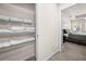 Linen closet with white wire shelving, full of neatly folded towels and linens at 853 Bentley Drive Dr, Fairburn, GA 30213