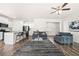 Open-concept living room with modern furnishings, wood floors, and an inviting atmosphere for relaxing at 853 Bentley Drive Dr, Fairburn, GA 30213