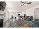 Open-concept living room connected to the kitchen with hardwood flooring and ample natural light at 853 Bentley Drive Dr, Fairburn, GA 30213