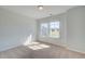 Well-lit bedroom with carpet, neutral walls, and bright natural light at 107 St Annes Pl, Covington, GA 30016