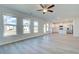 The living area boasts large windows, offering plenty of natural light and backyard views at 107 St Annes Pl, Covington, GA 30016
