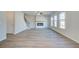 Bright and spacious living room featuring a modern fireplace and multiple windows at 107 St Annes Pl, Covington, GA 30016