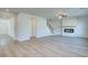 Open-concept living room featuring a fireplace and staircase to the second floor at 107 St Annes Pl, Covington, GA 30016