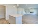 Spacious living area with fireplace and open access to island kitchen and pantry at 107 St Annes Pl, Covington, GA 30016