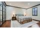 Spacious bedroom with hardwood floors, dark trim, and a decorative rug at 2499 Peachtree Ne Rd # 108, Atlanta, GA 30305