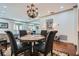 Cozy dining area with a chandelier, elegant chairs, and views to the living room at 2499 Peachtree Ne Rd # 108, Atlanta, GA 30305