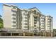 Elegant multi-story condominium building with garage parking and covered entry at 2499 Peachtree Ne Rd # 108, Atlanta, GA 30305