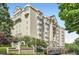 Elegant multi-story condominium building with manicured landscaping and a secure gated entrance at 2499 Peachtree Ne Rd # 108, Atlanta, GA 30305