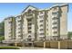 Impressive exterior of a luxury apartment building with multiple balconies and elegant architectural details at 2499 Peachtree Ne Rd # 108, Atlanta, GA 30305