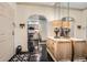 Inviting foyer with black floors, decorative mirror, and arched entrance to the kitchen at 2499 Peachtree Ne Rd # 108, Atlanta, GA 30305