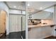 Well-lit kitchen featuring granite counters, stainless steel appliances, and mirrored backsplash to enhance space at 2499 Peachtree Ne Rd # 108, Atlanta, GA 30305