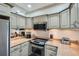 Kitchen featuring stainless steel appliances, granite countertops, and ample cabinet storage at 2499 Peachtree Ne Rd # 108, Atlanta, GA 30305