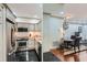 Open concept kitchen and dining area offers modern appliances and inviting ambiance for dining at 2499 Peachtree Ne Rd # 108, Atlanta, GA 30305