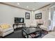 Comfortable living room with a neutral color palette, plush seating, and ample natural light at 2499 Peachtree Ne Rd # 108, Atlanta, GA 30305