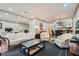 Open-concept living room flowing into the dining area, with plush seating and ample natural light at 2499 Peachtree Ne Rd # 108, Atlanta, GA 30305