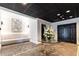 Welcoming lobby featuring stylish seating, a glass table with flowers, and a modern art piece at 2499 Peachtree Ne Rd # 108, Atlanta, GA 30305