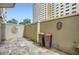 A private patio featuring slate flooring, decorative wall art, and potted plants, perfect for outdoor relaxation at 2499 Peachtree Ne Rd # 108, Atlanta, GA 30305