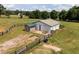 Spacious white barn with fenced perimeter, surrounded by green pastures at 255 Henson Way, Canton, GA 30115