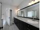 Bathroom featuring a double vanity with granite countertops and a large mirror at 255 Henson Way, Canton, GA 30115