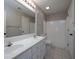 Bright bathroom with double vanity sinks, tile flooring, and a shower-tub combo at 255 Henson Way, Canton, GA 30115