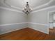 Elegant dining room showcasing decorative chandelier, and hardwood floors at 255 Henson Way, Canton, GA 30115