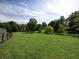 Picturesque landscape of green field with wooden fence and trees at 255 Henson Way, Canton, GA 30115