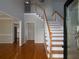 Bright and open foyer with hardwood floors and an elegant staircase at 255 Henson Way, Canton, GA 30115