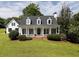 Charming single-Gathering home featuring a large front porch and manicured lawn at 255 Henson Way, Canton, GA 30115