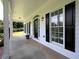 Inviting front porch featuring elegant columns, stylish lighting, and a decorative door at 255 Henson Way, Canton, GA 30115