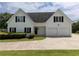 Spacious home with a two car garage and a well-maintained front yard at 255 Henson Way, Canton, GA 30115