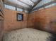 Horse stall with pine walls and metal frame with sand on the floor at 255 Henson Way, Canton, GA 30115