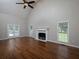 Bright living room with hardwood floors, fireplace, and lots of natural light at 255 Henson Way, Canton, GA 30115