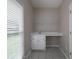 Mud room features a built-in desk, storage cabinets and a window with natural light at 255 Henson Way, Canton, GA 30115